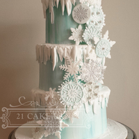 Frozen Snowflake Cake Snowflakes design is made using fondant discs, gumpaste snowflakes and the Cake Lace Crystal Mat.I coloured my cake lace with pale teal and...