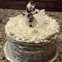 Olaf Cake 2 layer Olaf cake, gumpaste snowflakes.