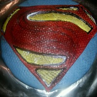 Man Of Steel I made this for my son's 16th birthday. It is made with my own version of marshmallow fondant, red velvet cake with raspberry filling...