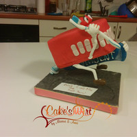 Don't Call Me The Tooth Fairy!!! This is a cake for a hard dentist! Is all suspended, the toothpaste is the only piece that touches the base ... I hope you like it!