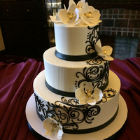 Buttercream Wedding Cake With Scrolling Pattern 3 tier buttercream cake with sugar orchids