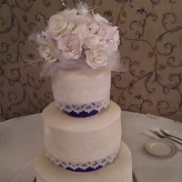 Wedding Cake My daughters wedding cake. Flowers I made from gumpaste. Lace is cake lace.