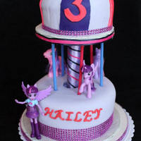 Twilight Sparkle Carousel Cake The stand/support for this is a home made stand made from plywood and pvc pipe. I simply hot glue gun the ribbon to the stand and it is...