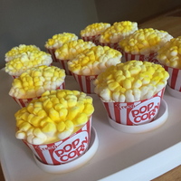 Popcorn Cupcakes Popcorn Cupcakes. Marshmallows with yellow food color spray for "popcorn".