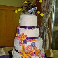 Tangled Inspired Wedding Cake A whimsical wedding cake, 4 tiers (12", 10", 8", 6") for a Disney princess and Tangled inspired cake (hence the cast...