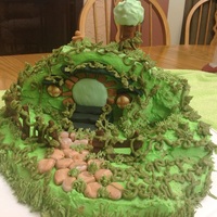 Hobbit Home Cake Made for my grandson. White cake with buttercream icing and a little fondant decor