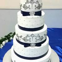Blue And Silver CAKE. There was some damage on the second tier but no biggie. No one even noticed.