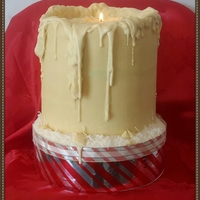 X-Mas Candle Sponge cream cake covered with chocolate ganache. It's a real candle top of the cake. I pored melted chocolate to make realistic.