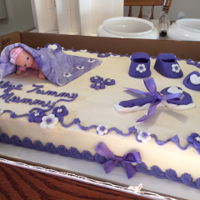 Baby Shower Cake Customer wanted all purple accents. All accents except the baby was made of fondant.