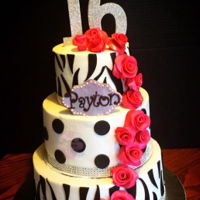 Sweet 16 Cake Vanilla, chocolate, and strawberry tiers with buttercream and fondant accents and 16 gumpaste roses.