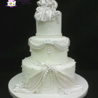 Beads & Lace Wedding Cake I wanted to create a more elegant wedding cake than what I'd done in the past. I believe I accomplished my goal. Enjoy!