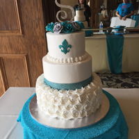 Rosette Cake Three tier wedding cake with gum paste roses