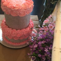 Bling Cake Here is a two-tier chocolate cake with buttercream icing. This was made for someone's 21st birthday.