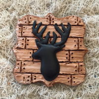 Deer Head Silhouette On A Planked Chocolate Sugar Cookie Chocolate sugar cookie with planking technique and deer head silhouette royal icing transfer.