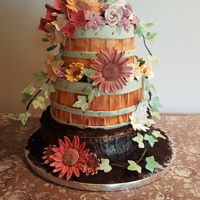 Flower Basket Wedding Cake The bride wanted a rustic cake. Bottom is German chocolate and top two cake are red velvet.
