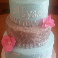 Graduation Glitter Graduation cake inspired by a prom dress. All layers are vanilla with raspberry buttercream filling. Frosted with buttercream frosting....