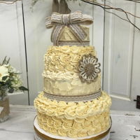 Wedding Cake This one was for a family member, the reception was in a barn the the heat was awful! Thank goodness it was for family, I made them cut it...