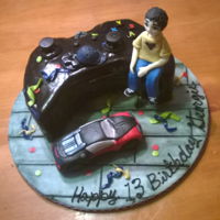 X Box One Controller Birthday cake with homemade fondant, rice krispie treat car and a gumpaste boy