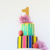 Color Me First Birthday! First birthday cake. Bold colors, drip and real flowers.