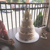 Mickey Themed Wedding Cake Ivory colored fondant, champagne luster dust Mickey heads, white chocolate castle (purchased not made by me), champagne ribbon- chocolate...