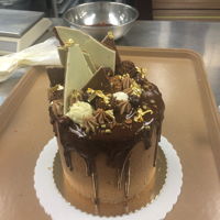 Nutella Overload Homemade Nutella ganache, chocolate cake with hazelnut feuilletine crunch, , Swiss meringue buttercream, chocolate mousse, and hazelnut...