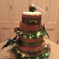 Pirouline Cake Green and brown holiday themed party for office. Vanilla and chocolate cake with buttercream frosting all surrounded in various types of...