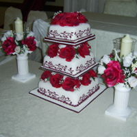 Cake With Stencils I made this decoration on a wedding cake, first I covered it in rolled fondant and then I used the stencils and the coloured icing to match...