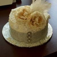 Gatsby Cake Lemon cake with Raspberry Mousse filling and vanilla buttercream icing. Simple piping enhanced with crystals, flowers and bling