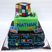 Pac Man Cake! Totally 80's pac man cake! Had ghost busters, mtv sign, and more all around it!