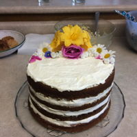 Naked Cake Brown butter pumpkin spice naked cake. With cream cheese icing, and decorated with real flowers.