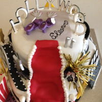 Hollywood Red Carpet Tiered cake with fondant and a few purchased gold pompoms with a fondant popcorn box - added popcorn at the event to complete the look....