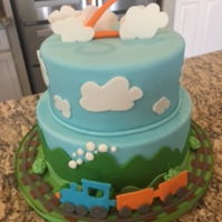 Train Cake This train theme cake was absolutely adorable, and very fun to make. I wanted the train to be somewhat 3D, so it looked like it was riding...