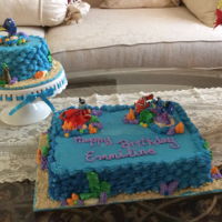 Finding Dory Birthday And Smash Cake The cakes are covered with modified italian buttercream. The sides are decorated with shell borders to simulate wave action. The smash cake...