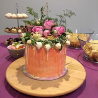 Holly's 4 Year Old High Tea Cake Chocolate chip cake filled with chocolate ganache.Iced with buttercream and drizzles of pastel coloured chocolates down the sides.Topped...