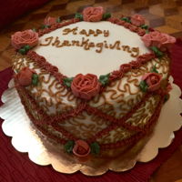 Thanksgiving Carrot Cake Three-layer carrot cake, frosted and decorated with cream cheese frosting.