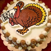 Thanksgiving Turkey Carrot Cake Three-layer carrot cake, frosted and decorated with cream cheese frosting along with a frozen transfer.