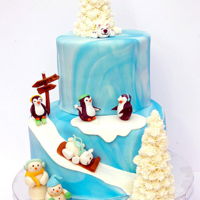 Winter Onederland Chocolate/Choc. buttercream top / Vanilla/Van buttercream bottom. Marbled fondant covered. Gumpaste figurines.