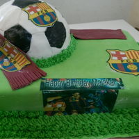 Birthday Barcelona football cake fondant cake with a ball on top with logo an grass