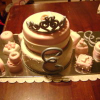 Cake For Emilee This is one of the first cakes I have ever made. The little cakes are also covered in fondant.