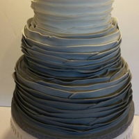 Grey Fondant Ruffled Wedding Cake 4 tiered wedding cake with grey ombre fondant ruffles