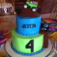 Monster Truck Cake Buttercream cake with toy monster trucks and chocolate cake mud.