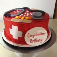 Nursing Cake Buttercream cake with fondant decorations.
