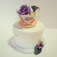 Teacup And Flowers Chocolate cake with raspberry coulis and dark chocolate mousse and buttercream icing. Handmade gumpaste teacup and saucer, fondant pearls,...