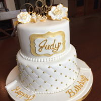 80Th Birthday Cake White vanilla cake covered with fondant with gold accents on flowers, quilt affect and name tag.