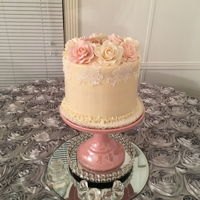 Birthday Cake Vanilla bean buttercream cake with gum paste roses and cake lace