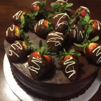 Chocolate Covered Strawberry Chocolate cake, chocolate ganache, chocolate covered strawberries as decorations.