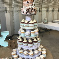 Wedding Birchwood Cake And Cupcake Tower Birchwood cake tops this cupcake tower holding 70 cupcakes with hand made cupcake wrapper for this beautiful outside wedding