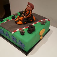 Go Kart I made the go kart and person from fondant