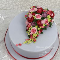 Love In Bloom The cake is decorated with royal icing flowers.