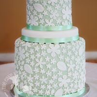 Mint Green Lace Wedding Cake A gorgeous design of lace with a mint green back drop.